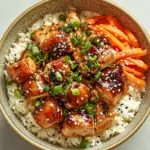 inesboulila A vibrant bowl of sticky chicken rice featuring gla 6b3de8a3 a4b9 499b acc4 3a7a10913ed3