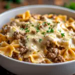 inesboulila A bowl of cheesy beef and bowtie pasta coated in a 8112e34b 0671 4bcf aedd 391f349e84e8