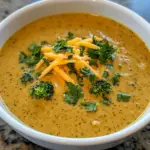inesboulila A bowl of high protein broccoli cheddar soup rich a 298c1205 5a5c 40b5 b526 b28256027350