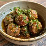 inesboulila A bowl of keto garlic butter meatballs coated in a 050a235b 52b6 40fa 9d5c 33b785bcc58f