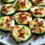 inesboulila A plate of cheesy bacon cucumber bites featuring cr 4fd3e472 0a87 4fa5 a79f bf64a483d4c2