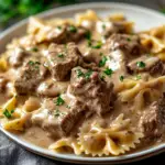 inesboulila A plate of creamy beef and bowtie pasta featuring t 4149672c 12e5 49d5 aeda 7bccdfba2bb5