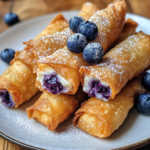 inesboulila A plate of crispy golden Blueberry Cream Cheese Egg 7e709fd1 a329 4072 86d3 764f17d9b20e