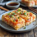 inesboulila A plate of golden crispy rice squares with a perfec 84acf84b 2d35 4aeb b21a c1d6db20d124