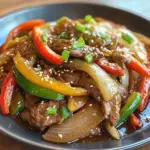 inesboulila A plate of pepper steak with bell peppers and onion 25869c98 a4e6 4150 a277 4ca1b78715b2