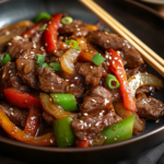 inesboulila A sizzling plate of Chinese pepper steak featuring b207f324 98ca 422d b8aa 43092fa9af72