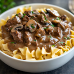 inesboulila A steaming bowl of Crockpot Beef Tips Noodles with 0c2340c9 b199 4310 a944 1698a3bb2b73