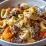 inesboulila A bowl of cheesesteak tortellini with tender pasta 810bcd00 3f2b 41d5 8f6c 2d4ed9506519