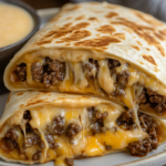 inesboulila A close up shot of a cheesy ground beef delight wra f766f8c7 613e 41d0 a420 328ab90e00b9