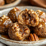 inesboulila A plate of Pecan Pie Balls neatly arranged on a rus 8e940489 c2a4 40cf a693 ac163a943462