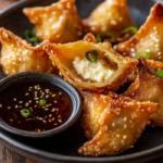 inesboulila A plate of golden brown cream cheese wontons perfec 66cd75f0 1601 4907 b67f f7bbe933ae3b