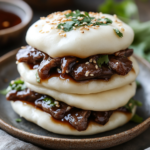 inesboulila A stack of soft pillowy steamed bao buns filled wit cf600f3a f174 4858 aebc 638939960848