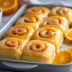 inesboulila A tray of freshly baked homemade glazed orange roll 3cc491ea da43 4ea5 96be 290da284f798