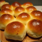 Freshly baked Tasty Sourdough Discard Hawaiian Rolls, golden and fluffy, ready to serve.